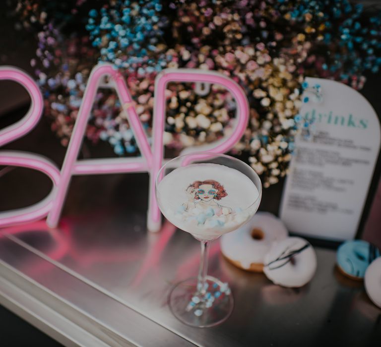 Pink neon bar sign and cocktail at candy crush inspired pastel wedding inspiration shoot