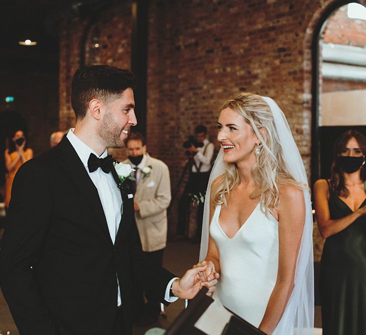 Bride and groom laughing during the intimate Gas Street Church wedding ceremony 