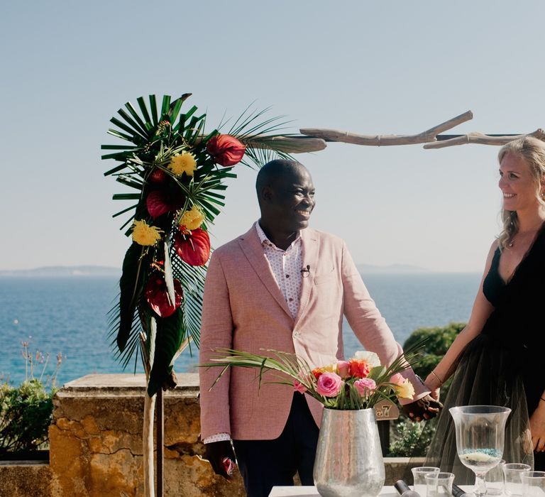 Wooden arch with tropical wedding flower decor 