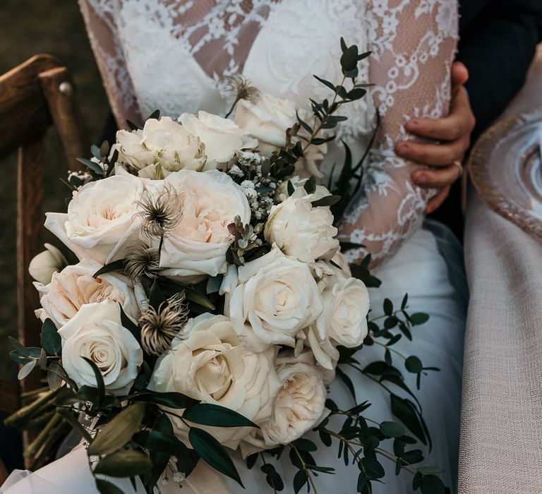 Classic white rose wedding bouquet and foliage 