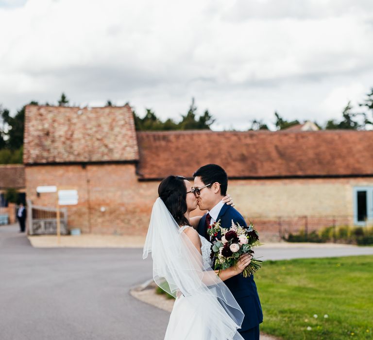 Bride & groom kiss on their wedding day