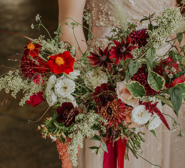 Red, white and green foliage wedding bouquet with dahlias and gerberas and anemones