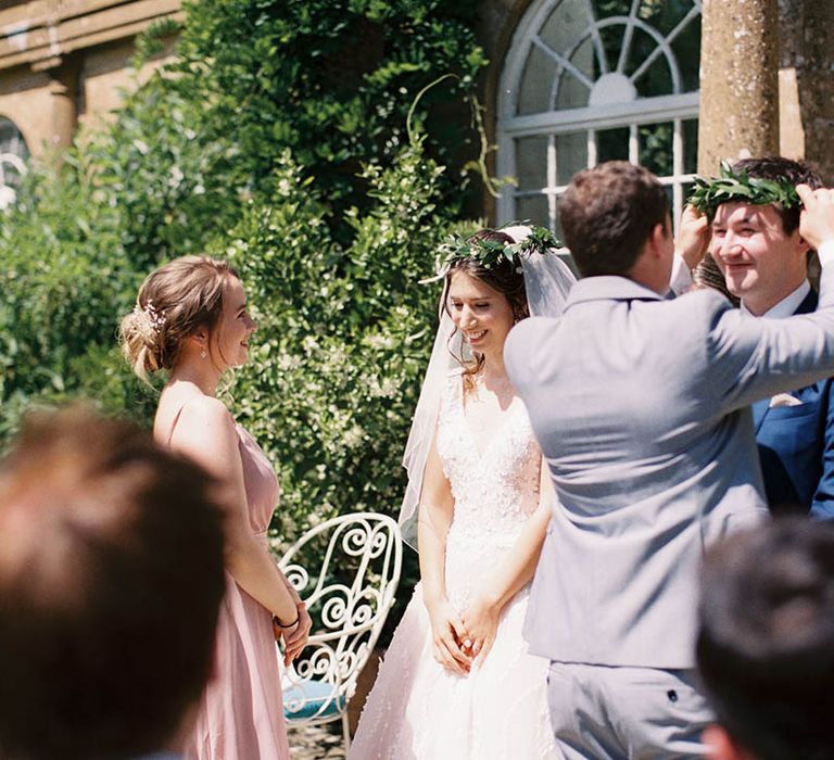 Bride & groom during crowning ceremony wedding 