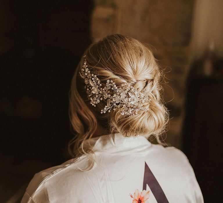 Pinned bridal undo with embellished hairpiece