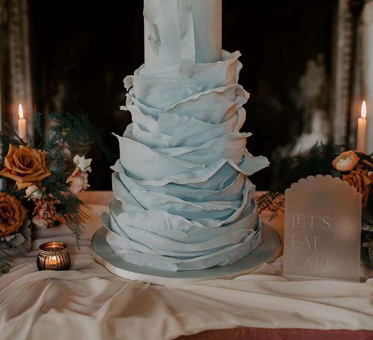 Tall luxury ruffle wedding cake by Poppy Pickering Cakes 