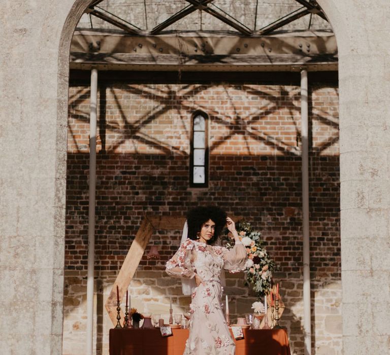 Chiddingstone Park wedding inspiration with black bride in a pink embroidered wedding dress with long sleeves 