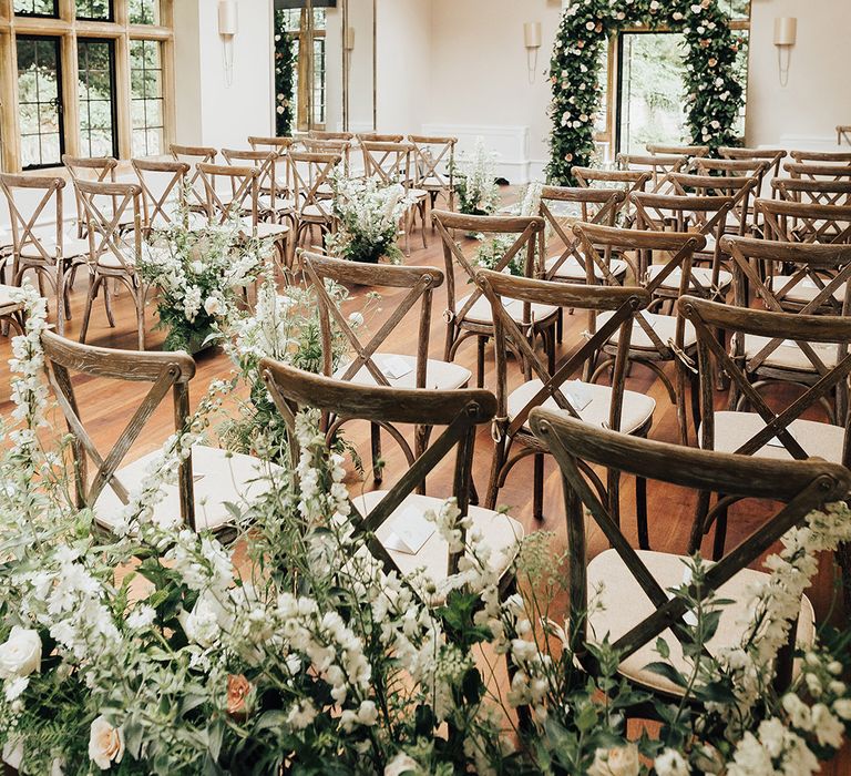 wedding ceremony flowers at Foxhill Manor with green foliage and roses 