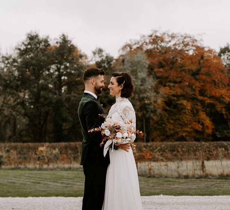 Bride and groom look lovingly into each other's eyes