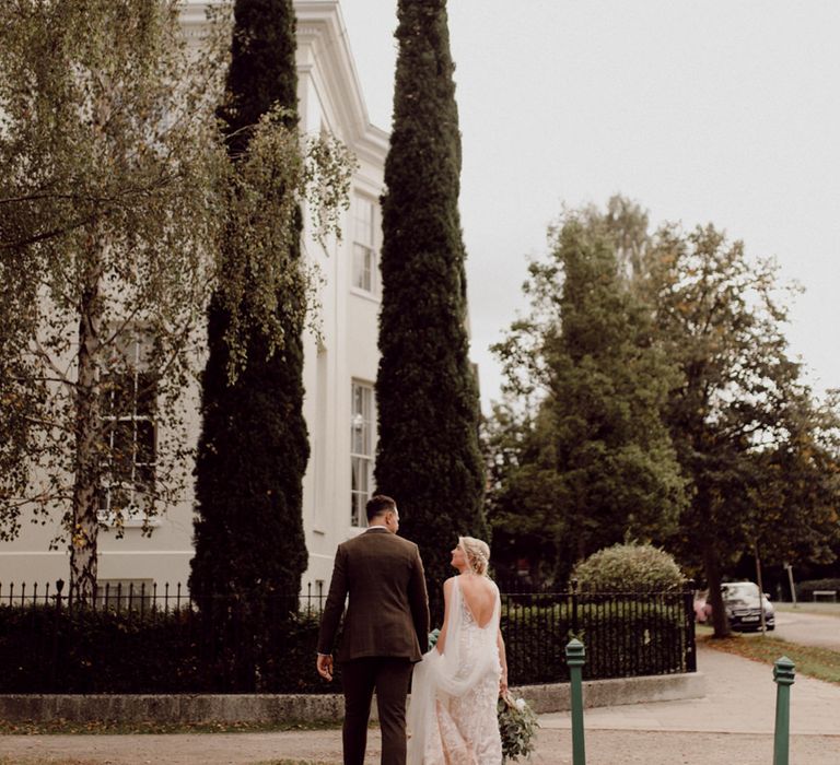 Bride and groom walk outside of their wedding reception, No.38 The Park