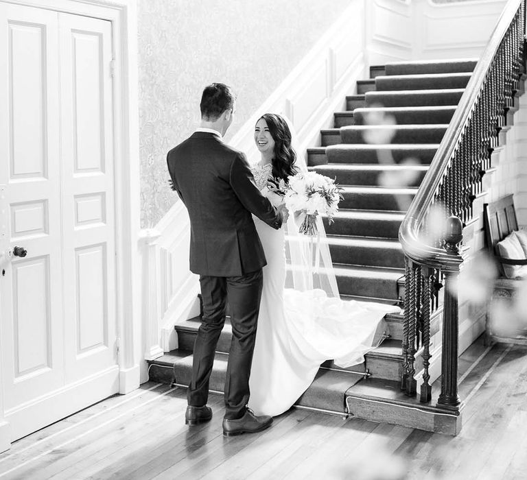 Bride and groom first look moment at Ardington House wedding venue 