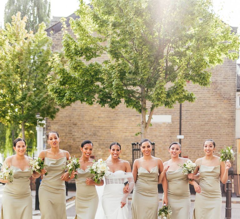 Sage green satin cowl neck bridesmaid dresses for fun city wedding in London 