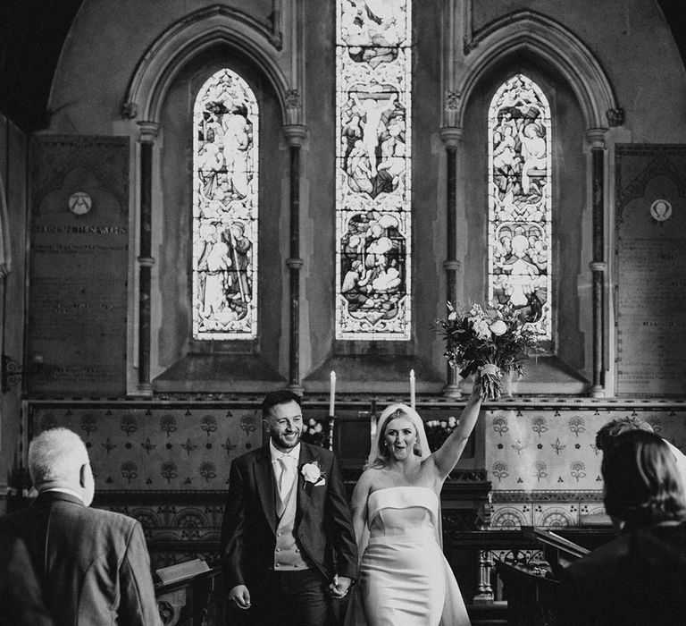 Black and white photo of the bride and groom at their church wedding in Essex 