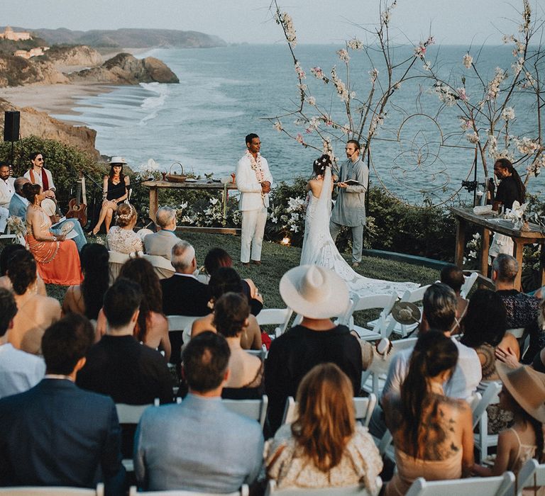 Outdoor coatsal wedding with circular ceremony and ocean views at Tigre Del Mar, Mexico