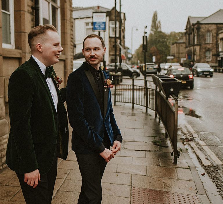 Gay wedding with two grooms in luxe velvet suit jackets for spooky wedding 