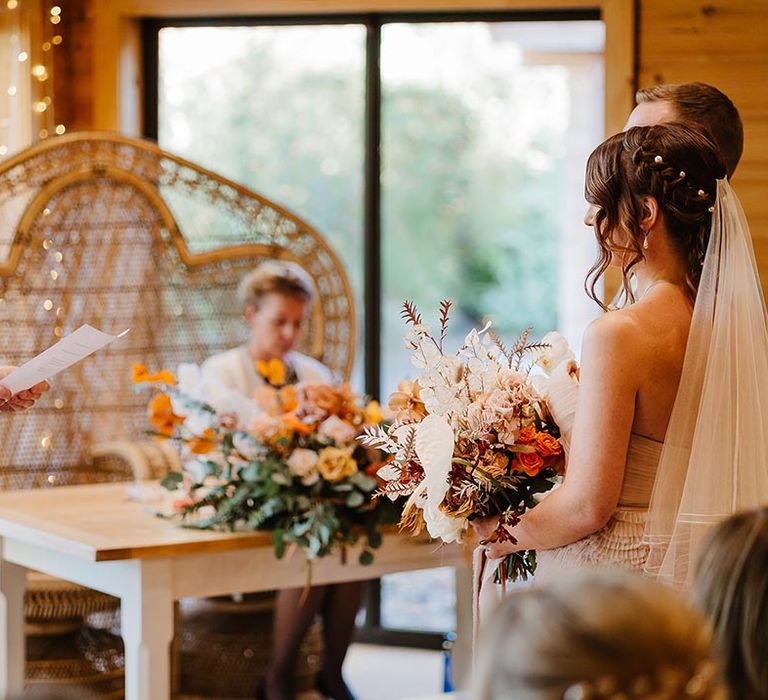 A groomsman performs a wedding reading at the traditional civil wedding ceremony 