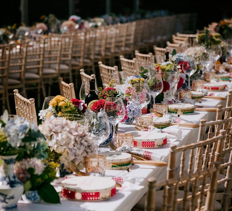 Pastel colourful wedding tablescape with tambourine wedding favours 