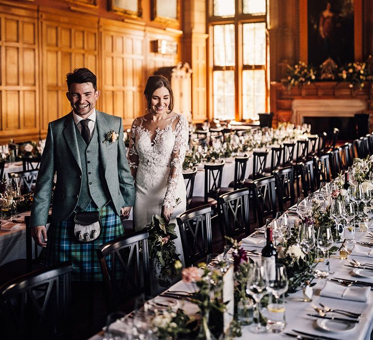 bride-and-groom-walking-around-their-wedding-breakfast