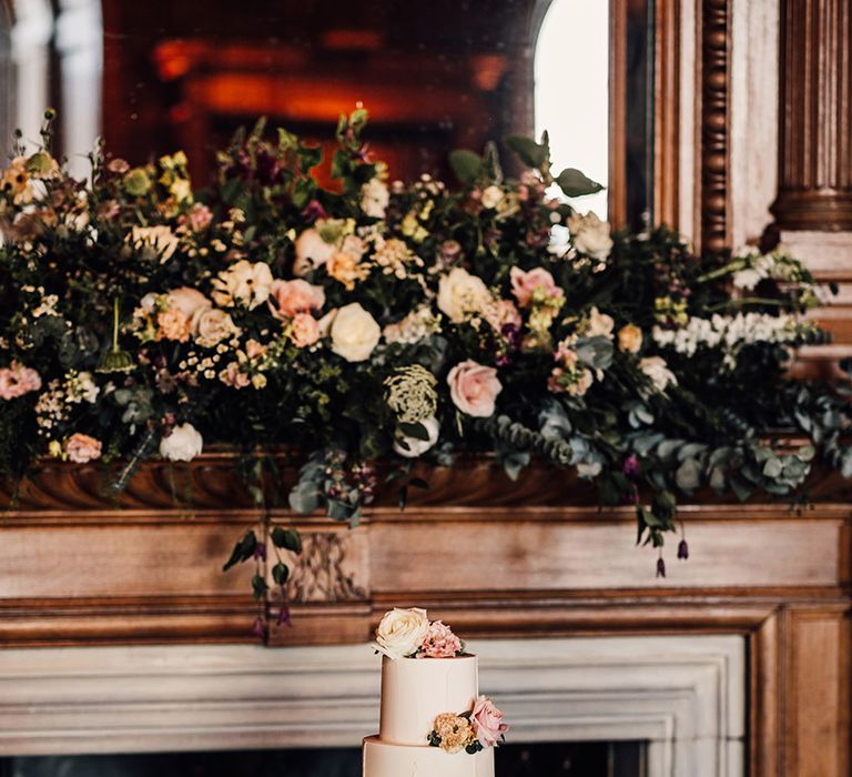 three-tier-white-iced-wedding-cake-with-pink-rose-flowers