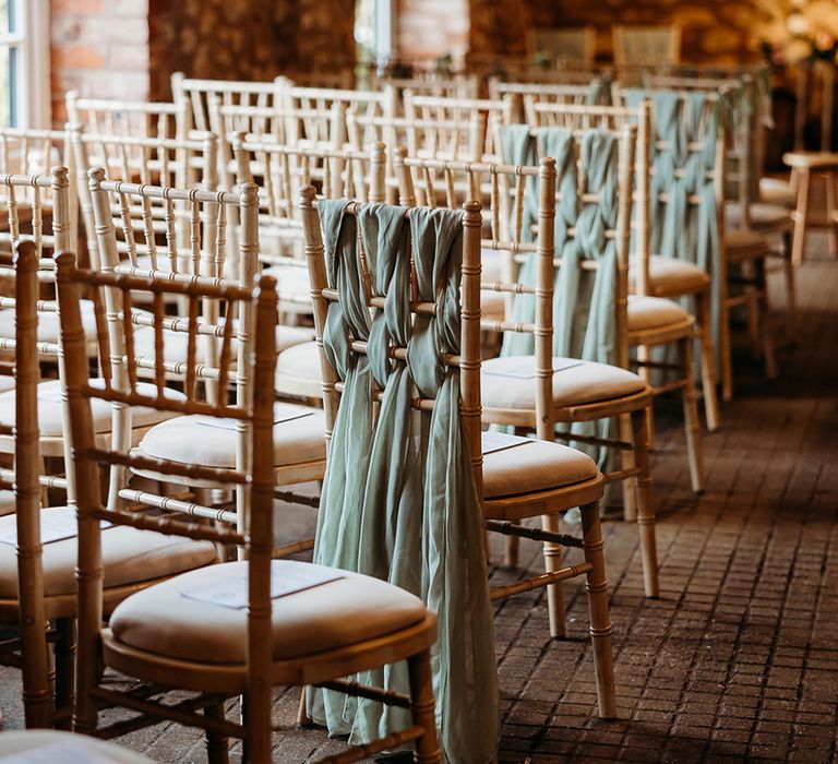 green-drapery-on-wedding-chairs