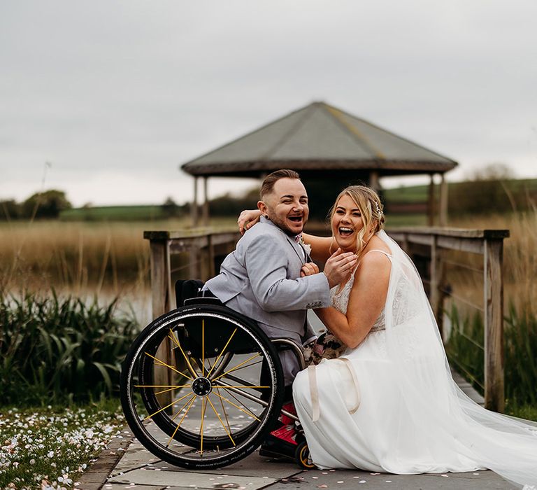 groom-wearing-light-blue-wedding-suit-with-bride-posing-for-their-couple-portraits