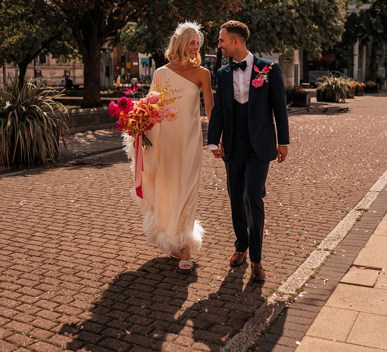 bride-in-feather-wedding-dress-with-groom