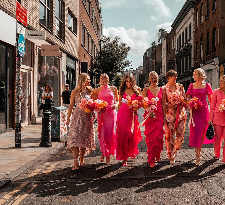 mismatched-pink-bridesmaid-dresses-and-suits