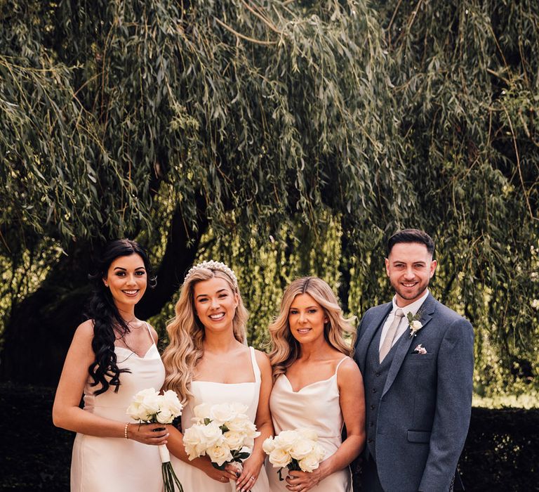 bridal-party-wearing-gold-bridesmaid-dresses-with-bridesman