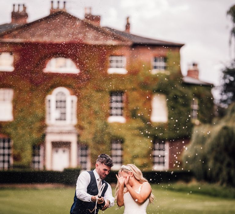 champagne-pop-moment-at-wootton-hall-wedding