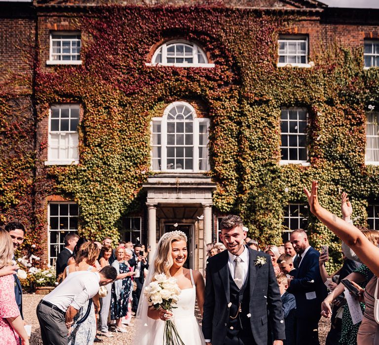 confetti-moment-outside-country-house-wedding-venue