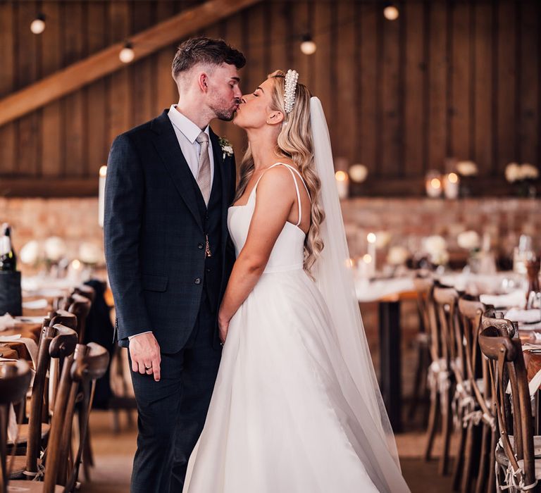 cute-couple-portrait-of-bride-and-groom-at-rustic-barn