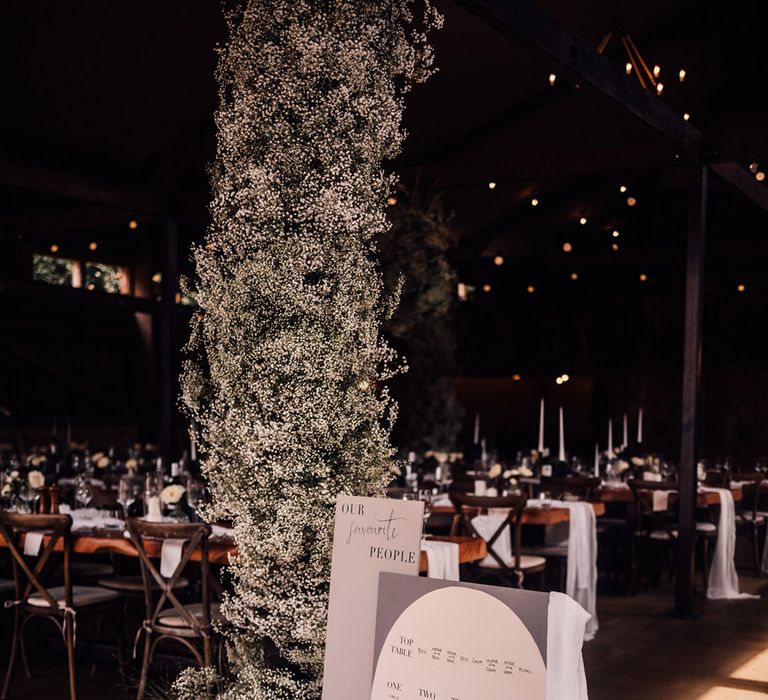 epic-gypsophila-wedding-flower-arrangement-with-table-plan-sign