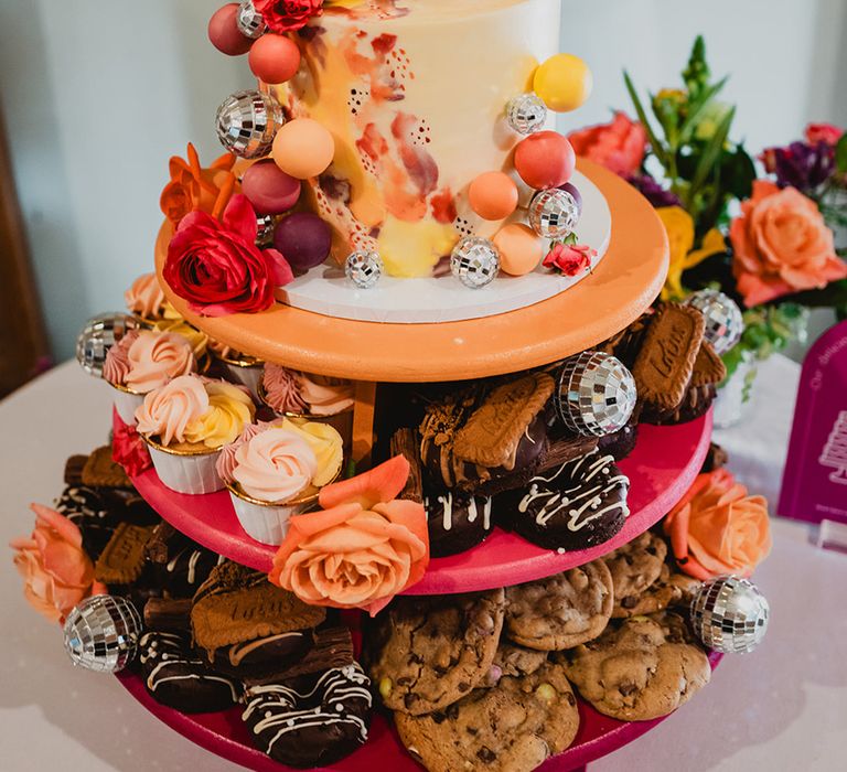 sweet-dessert-tower-with-cookies-brownies-and-wedding-cake