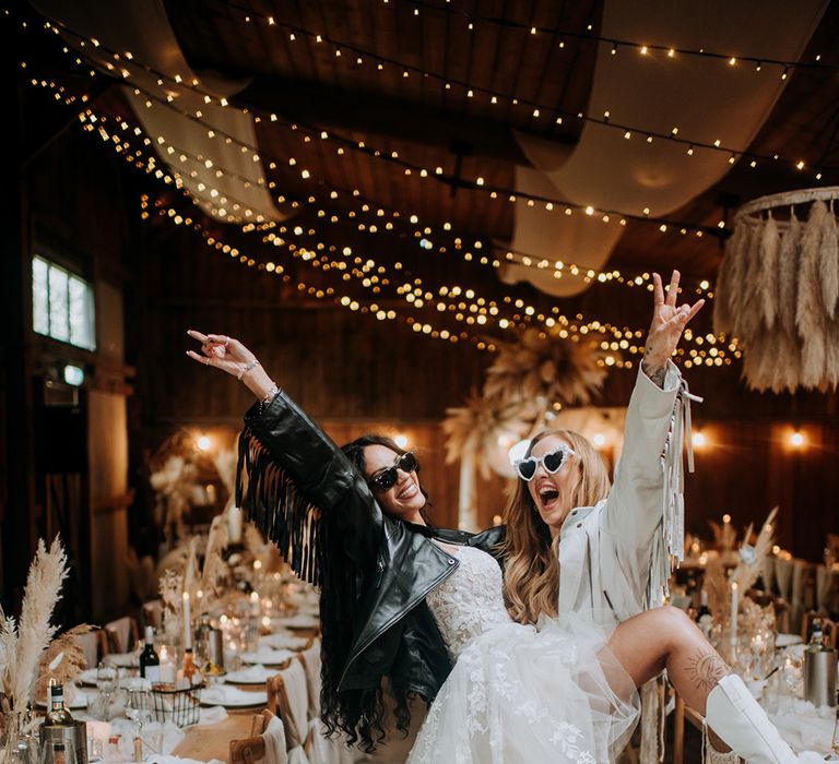 brides-at-boho-wedding-wearing-leather-jackets-and-sunglases