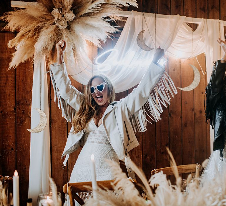 brides-in-tassel-leather-jackets-with-sunglasses-at-top-table