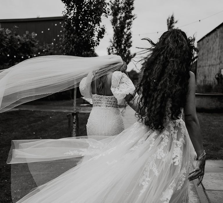 brides-walking-hand-in-hand