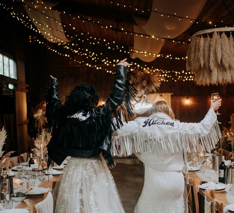 brides-wearing-black-and-white-leather-jackets-with-fairy-lights