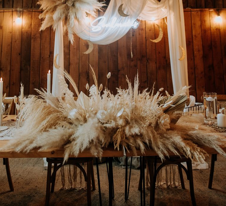 pampas-grass-floating-arrangement-with-disco-balls-and-neon-sign