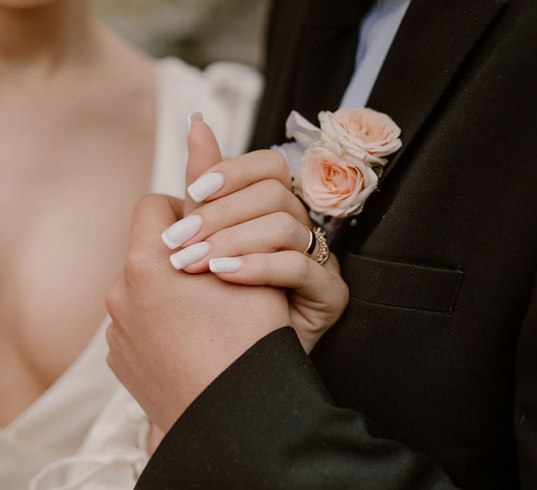 bride-wearing-biab-french-tip-wedding-nails