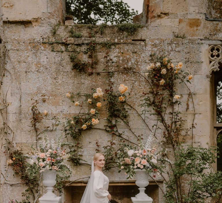 bride-wearing-embroidered-veil-with-princess-wedding-dress