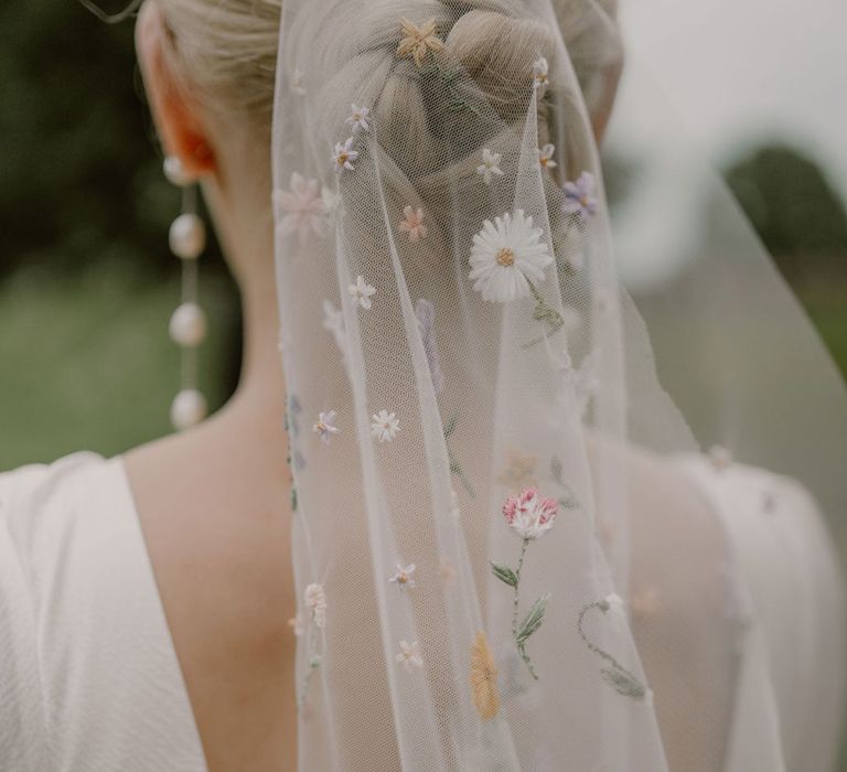 bride-wearing-flower-embroidered-veil