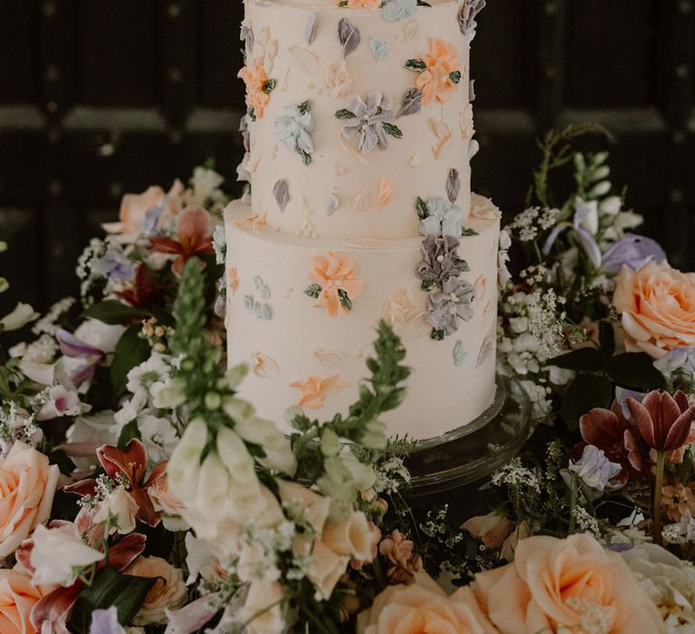 three-tier-flower-iced-wedding-cake