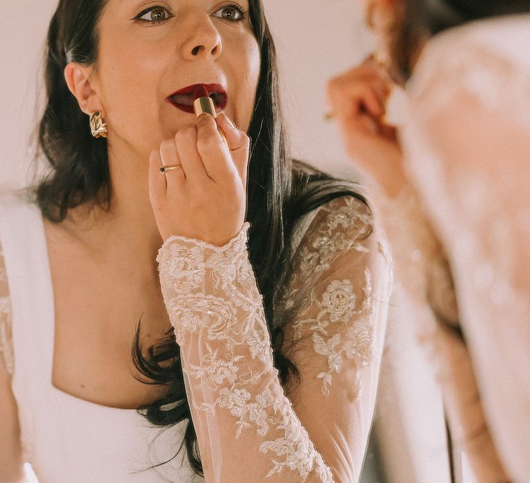 bride-puts-on-red-lipstick