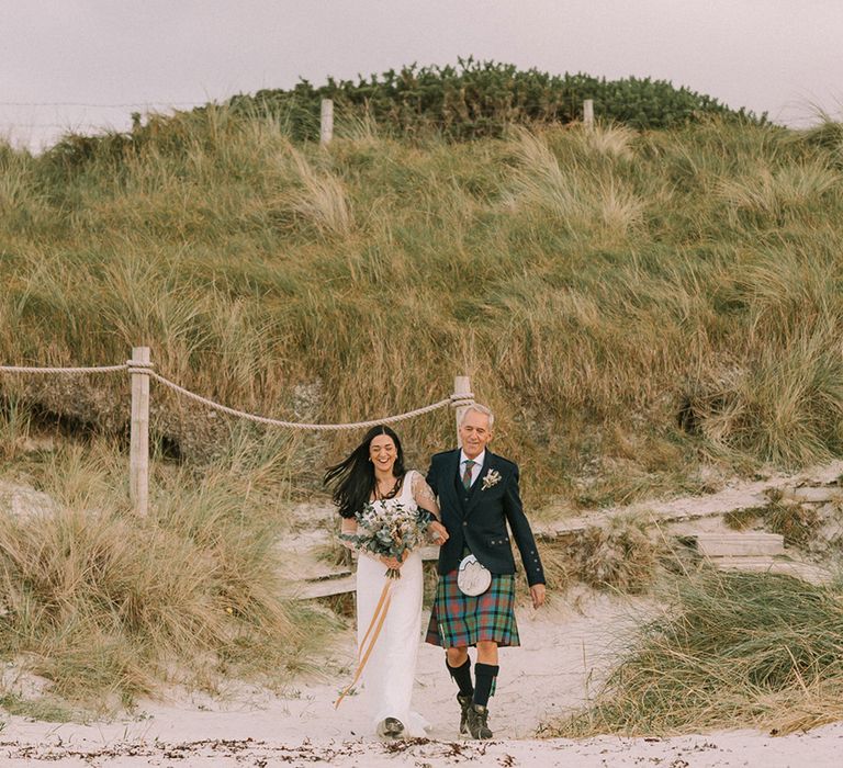 father-of-the-bride-in-kilt-walking-bride-down-the-aisle