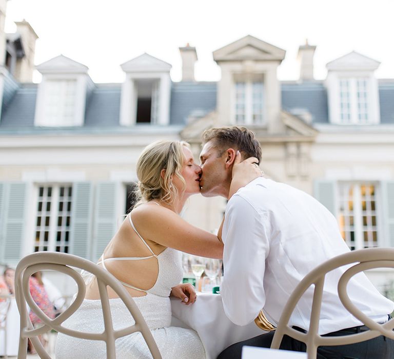 bride-and-groom-kiss-at-chateau-de-cormicy-wedding