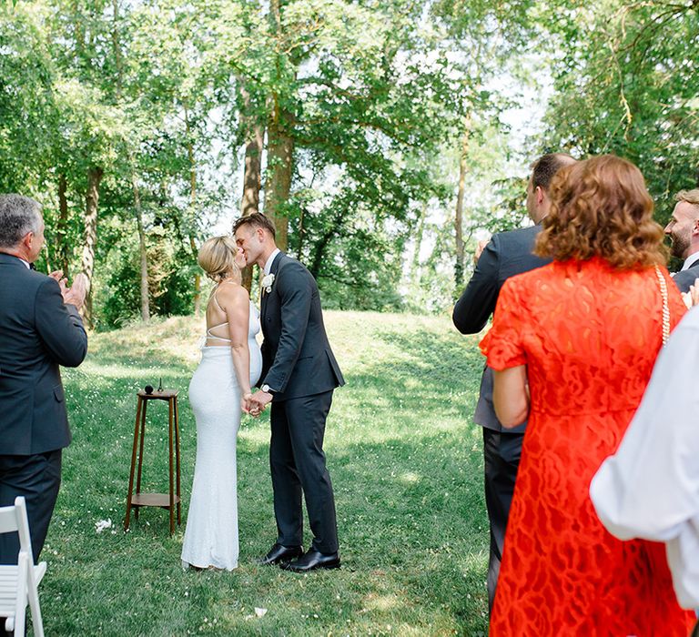 bride-and-groom-kiss-at-outdoor-wedding