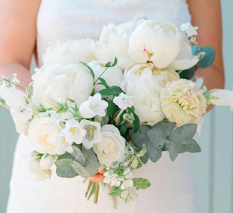 bride-holding-white-peony-bouquet