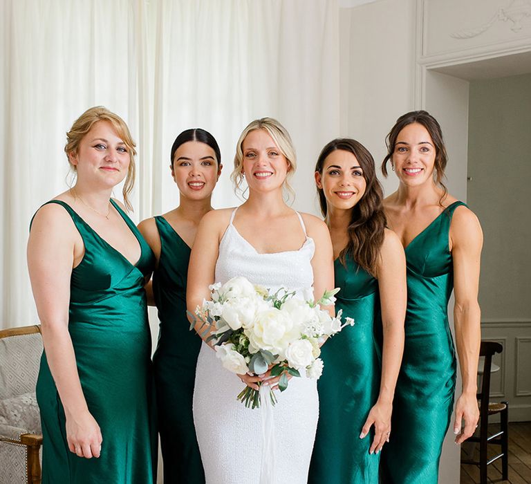 bridesmaids-wearing-green-satin-bridesmaid-dresses