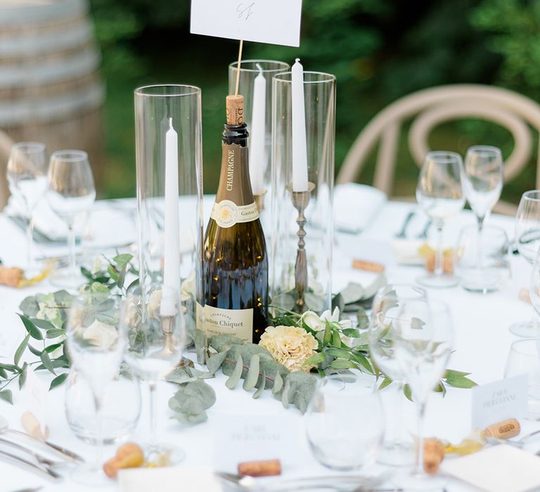 champagne-bottle-table-centrepiece-with-wedding-table-name