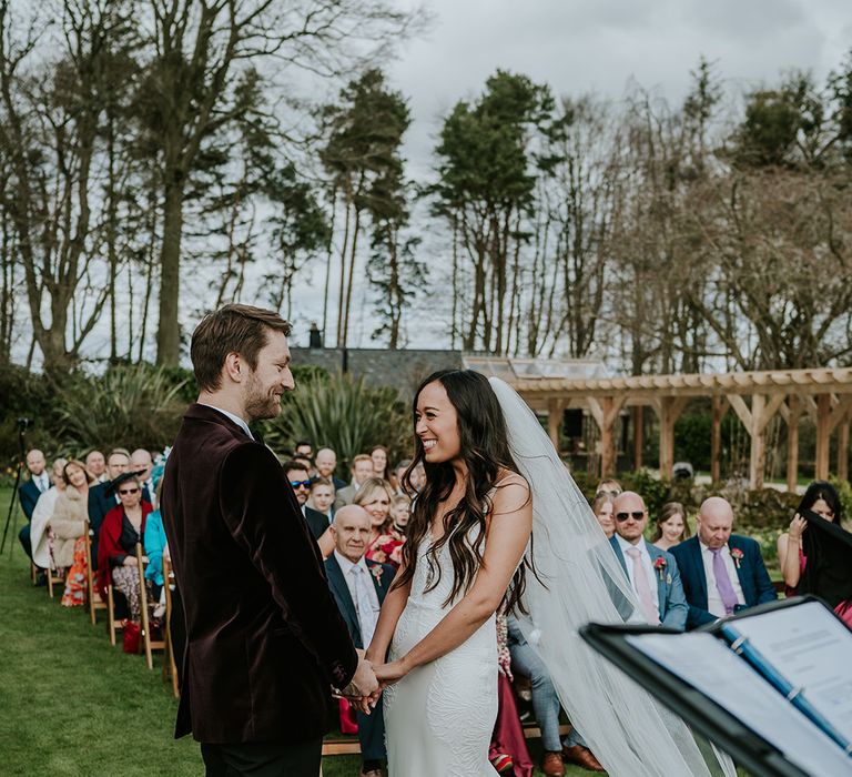 bride-in-mermaid-wedding-dress-with-groom-at-outdoor-wedding