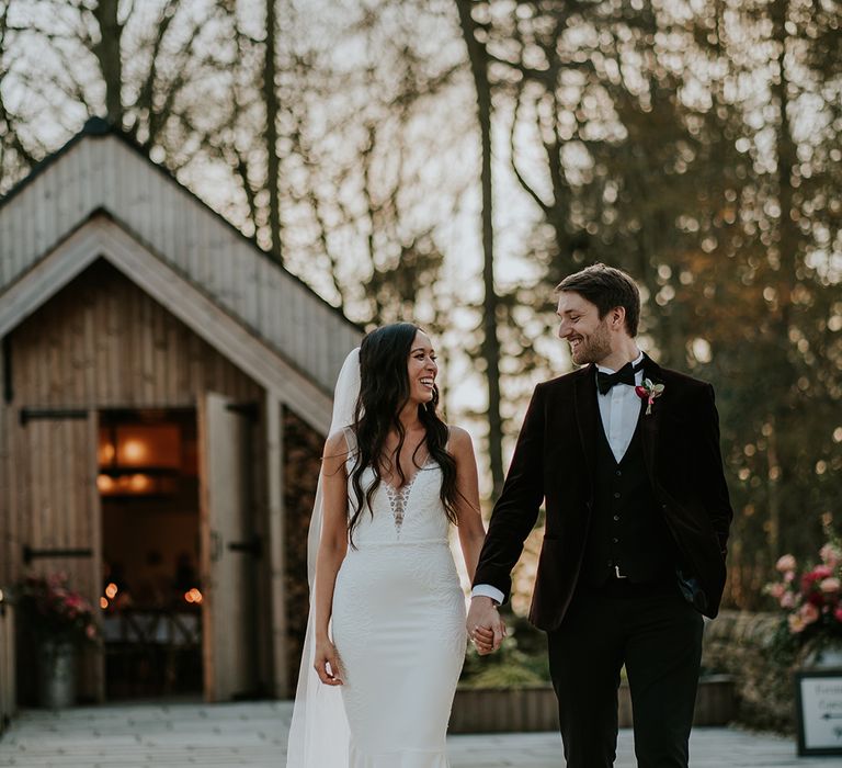 groom-in-black-tie-with-bride-in-mermaid-wedding-dress